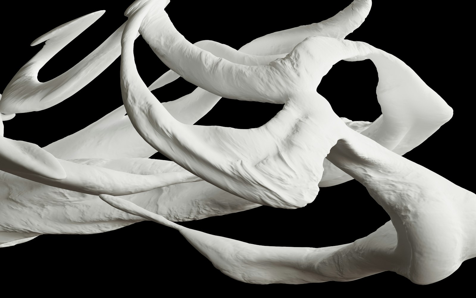 A carefully supported handmade art doll made from fabric, thread and sculpted materials on a clean studio surface